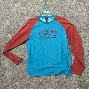 Blue and Burnt orange long-sleeve. Great condition.